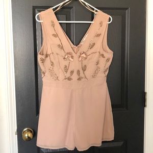 Beige romper with beading